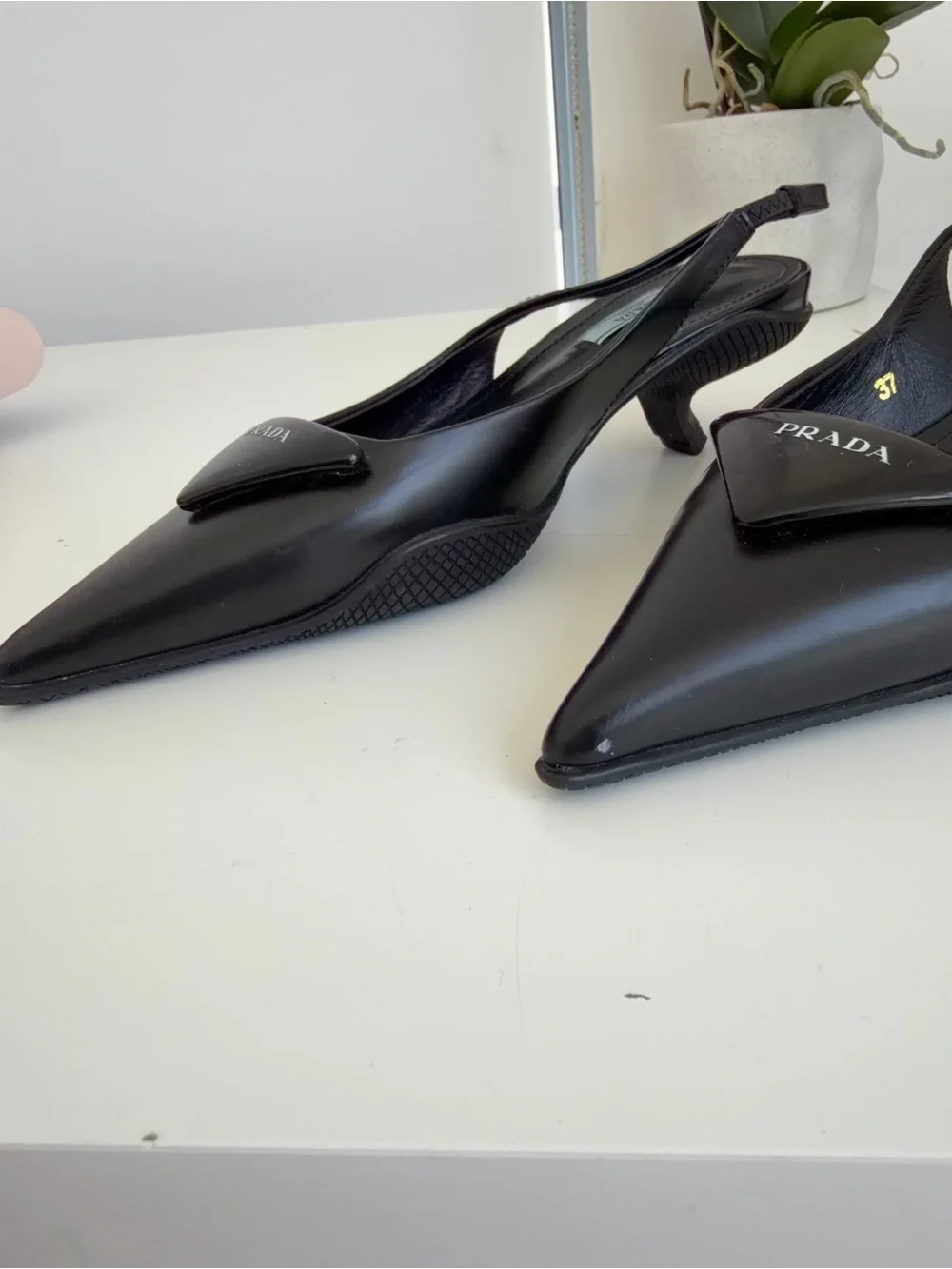 Prada Black Pointed Slingback Pumps with Logo Plaque